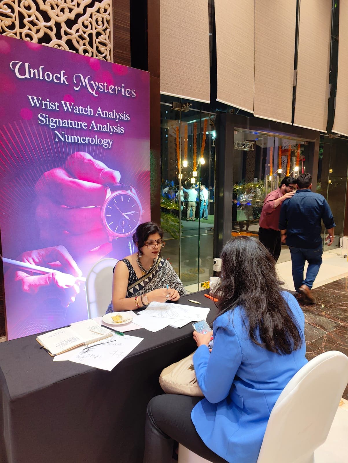 A signature analysis session at one of Rruchi Modayi's events